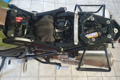 First Aid pack, tire repair kit, some cable ties and steel putty tightly packed