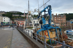 Oban harbor with McKaig's Tower and Oban distillery